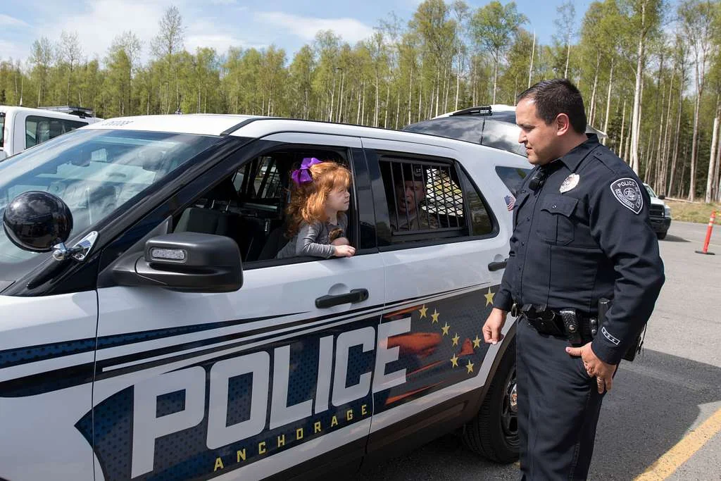 An officer from the Anchorage Police Department in full uniform