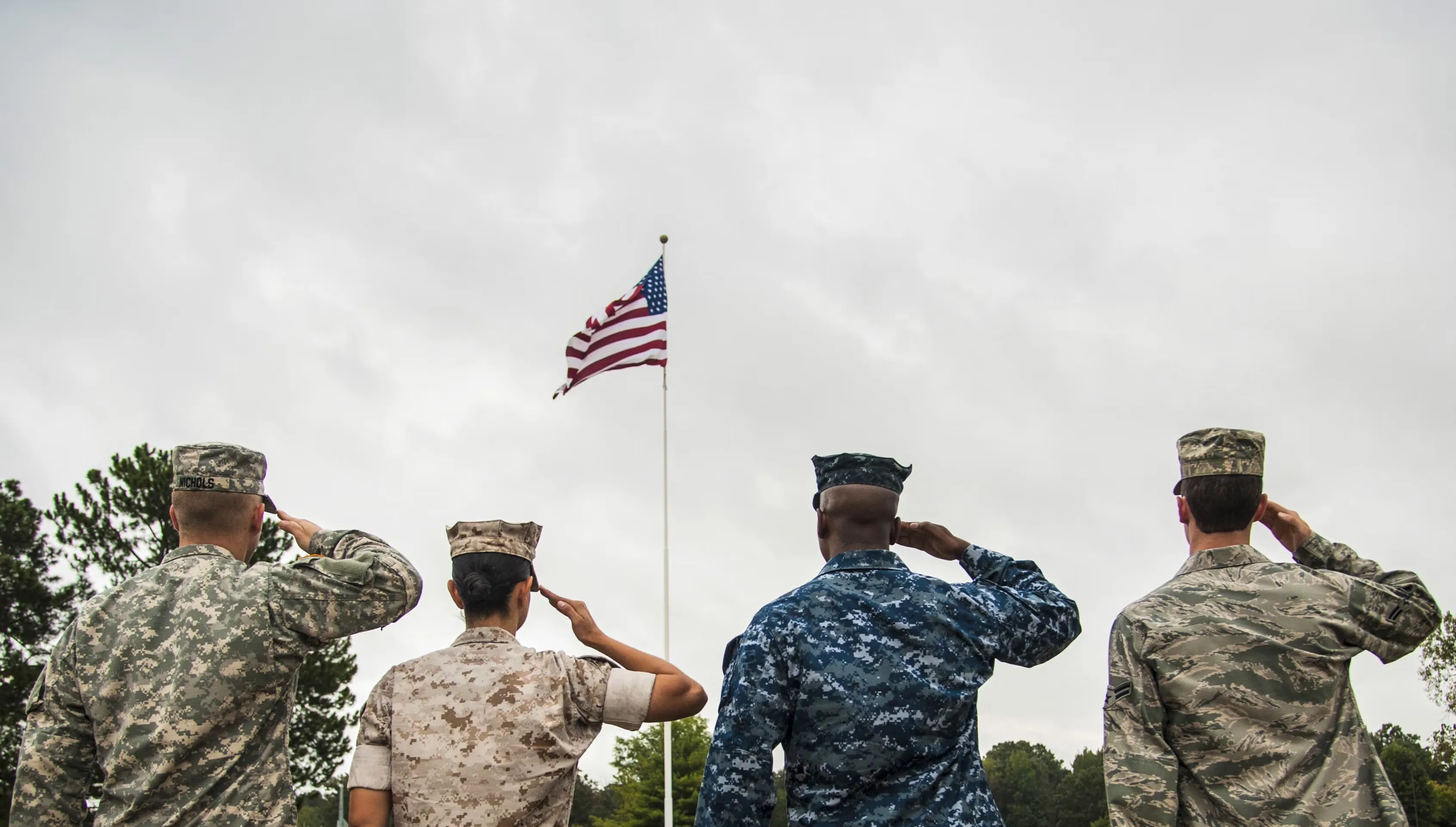 Military service member saluting in uniform
