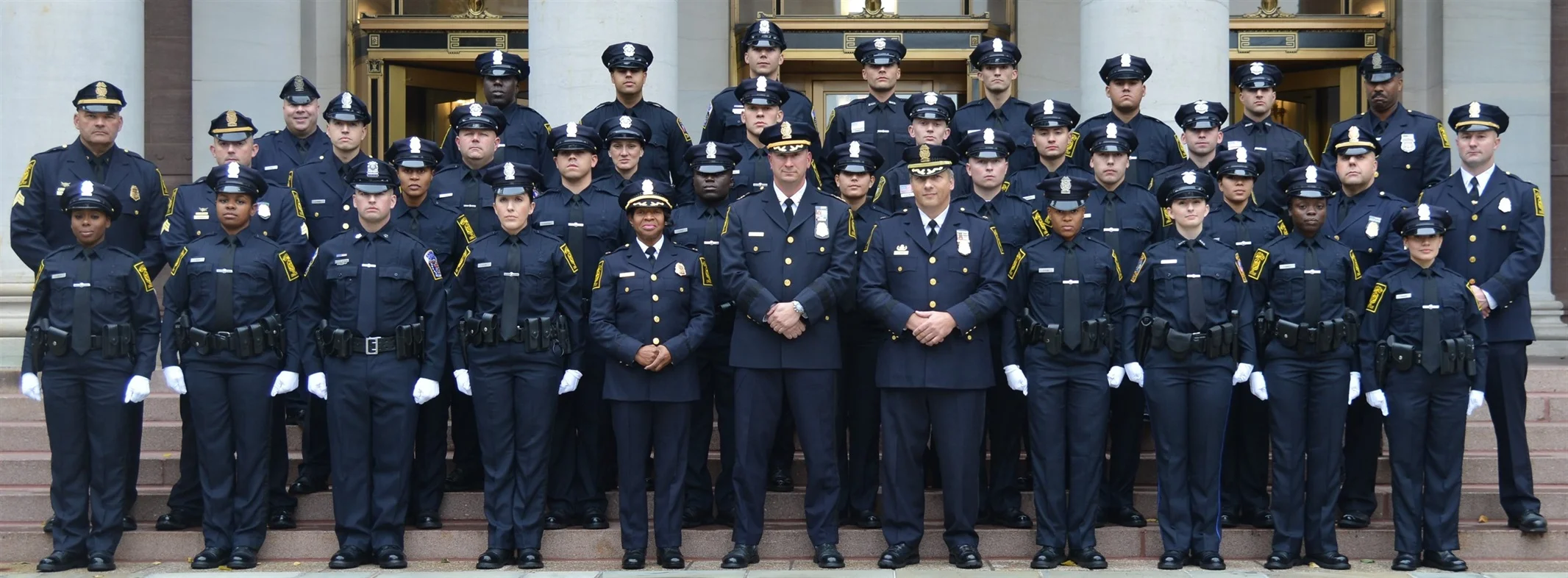 Police academy graduating class in sharp dress uniforms