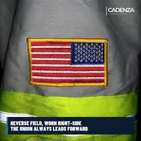 Reverse American flag patch sewn onto a hi-vis duty jacket